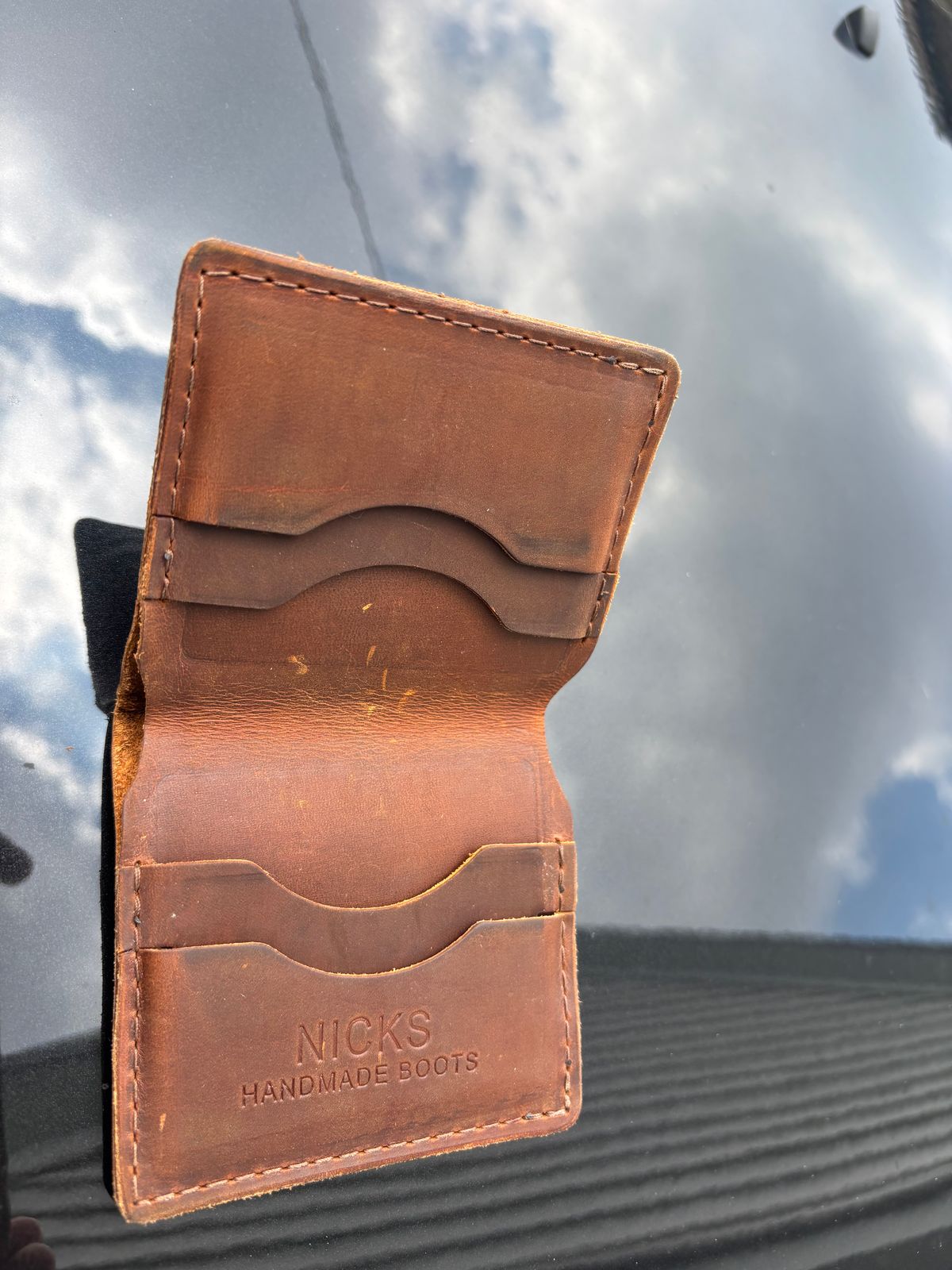 Photo by ZFitzGolf on July 8, 2025 of the Nicks Billfold in Horween Orange Predator.