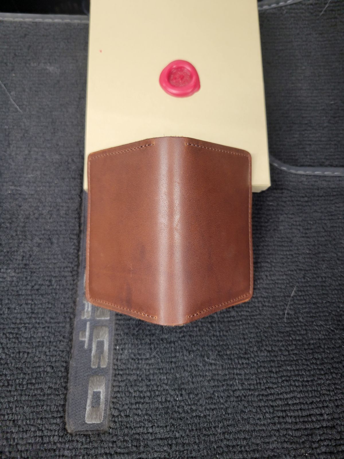 Photo by Cecilk on October 24, 2025 of the Ashland Leather Vertical Bugs Moran Wallet in Horween Brown Veg Tanned.