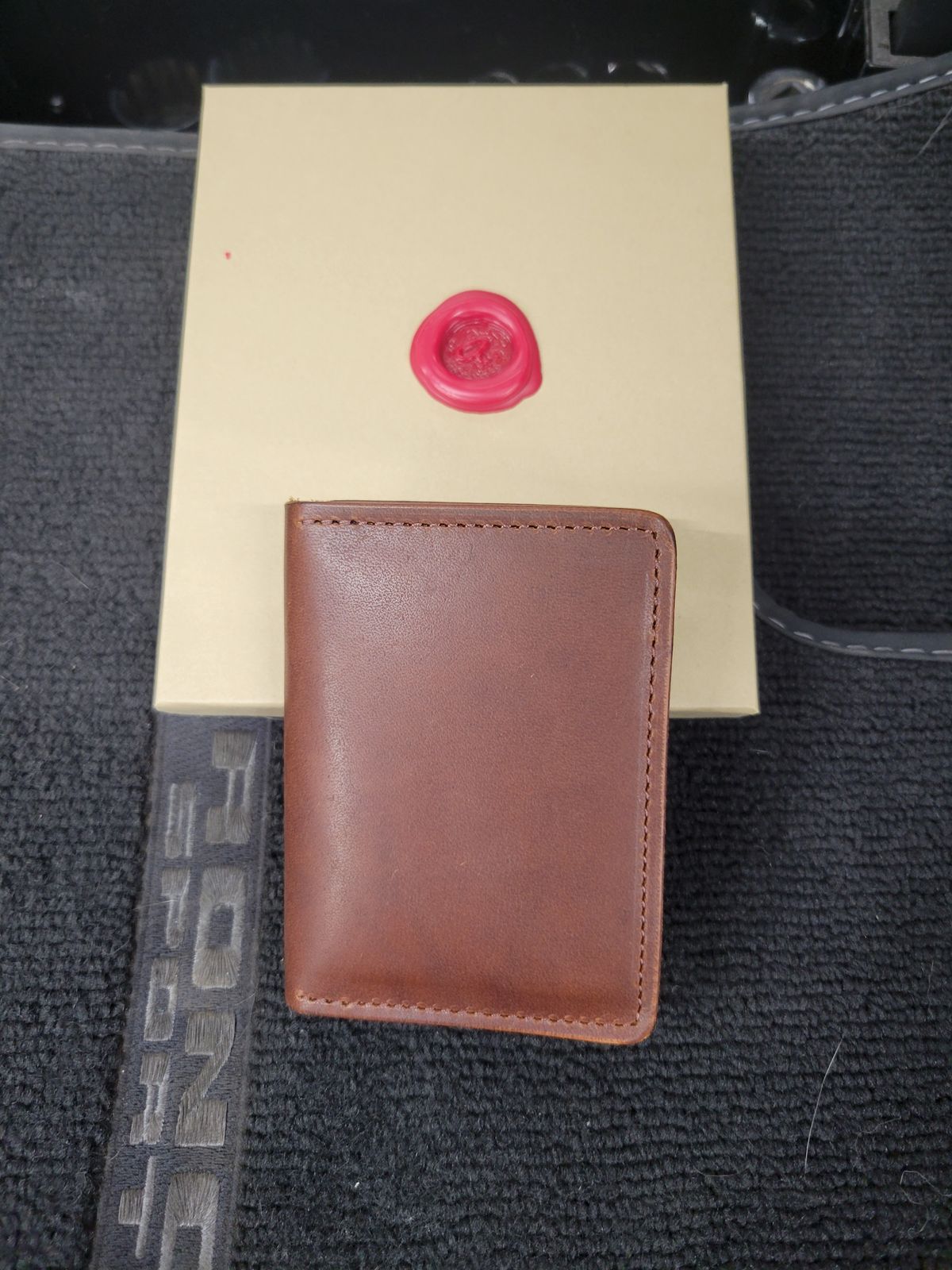 Photo by Cecilk on October 24, 2025 of the Ashland Leather Vertical Bugs Moran Wallet in Horween Brown Veg Tanned.