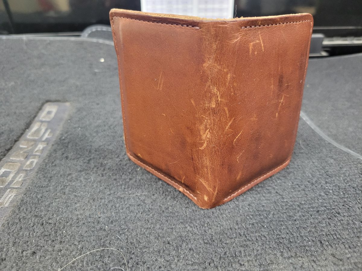 Photo by Cecilk on December 2, 2025 of the Ashland Leather Vertical Bugs Moran Wallet in Horween Brown Veg Tanned.