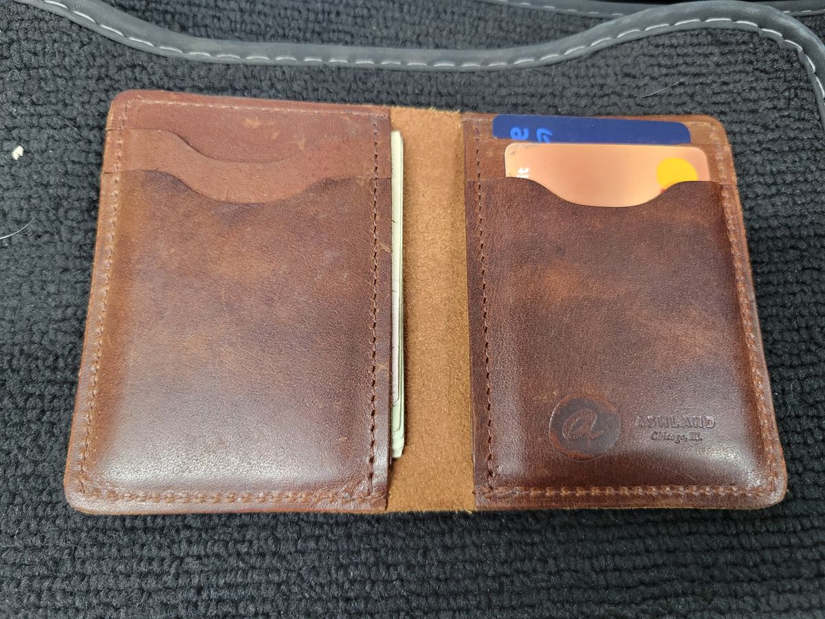 Photo by Cecilk on December 2, 2025 of the Ashland Leather Vertical Bugs Moran Wallet in Horween Brown Veg Tanned.