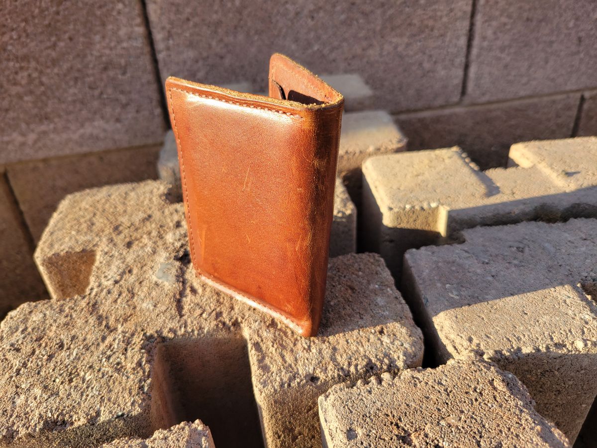 Photo by Cecilk on January 2, 2026 of the Ashland Leather Vertical Bugs Moran Wallet in Horween Brown Veg Tanned.