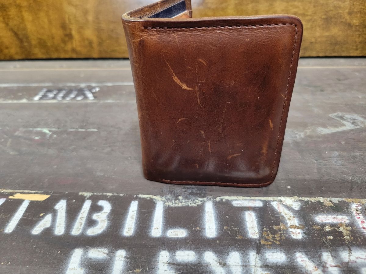 Photo by Cecilk on April 2, 2026 of the Ashland Leather Vertical Bugs Moran Wallet in Horween Brown Veg Tanned.