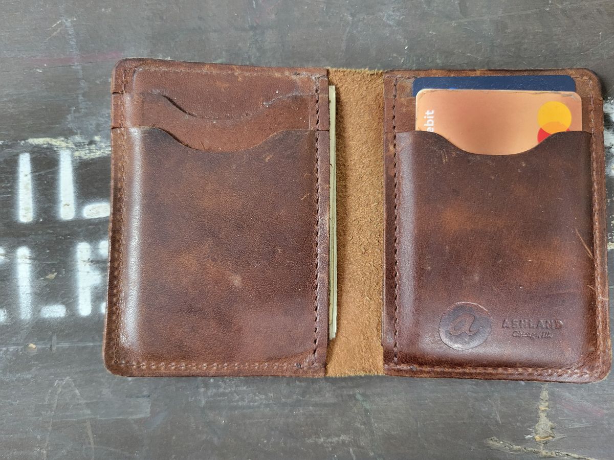 Photo by Cecilk on April 2, 2026 of the Ashland Leather Vertical Bugs Moran Wallet in Horween Brown Veg Tanned.