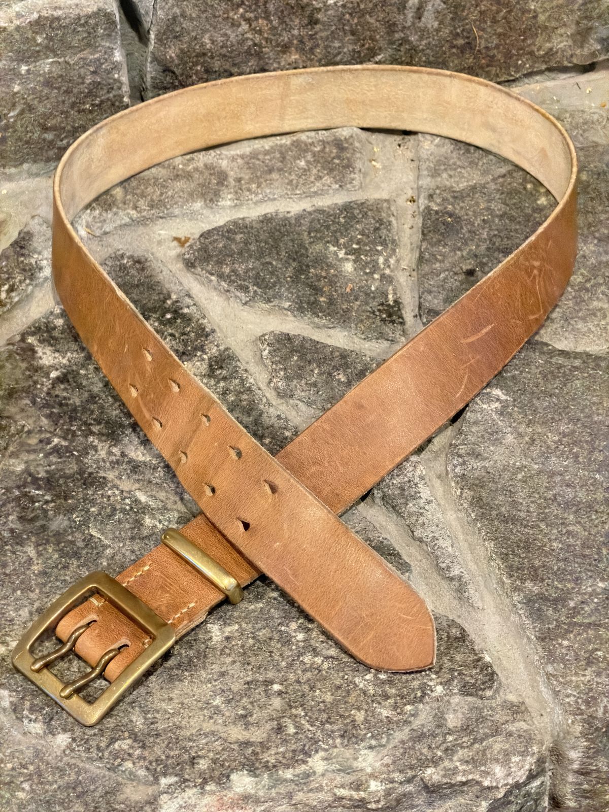 Photo by Aberhood on December 2, 2025 of the Hollows Leather Rail Belt in Dark Sand Cypress.