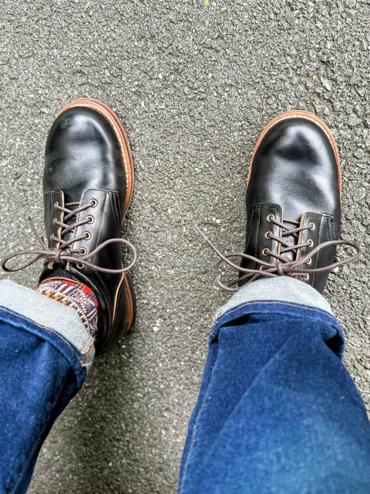 Photo by RealtorVic on July 16, 2025 of the Rolling Dub Trio Coupen in Horween Black Teacore Chromexcel.