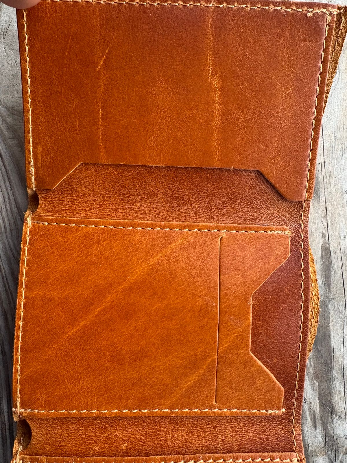Photo by MuttBarker on October 4, 2025 of the Rodos Leather Crafts Camel Full Grain Leather Trifold Wallet in Tochigi Oil Vachetta #1 Light Brown.