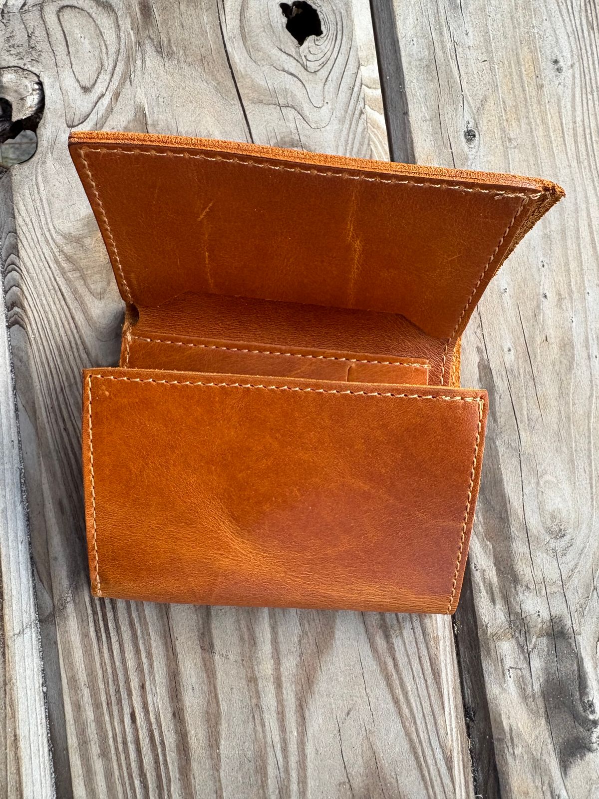 Photo by MuttBarker on October 4, 2025 of the Rodos Leather Crafts Camel Full Grain Leather Trifold Wallet in Tochigi Oil Vachetta #1 Light Brown.
