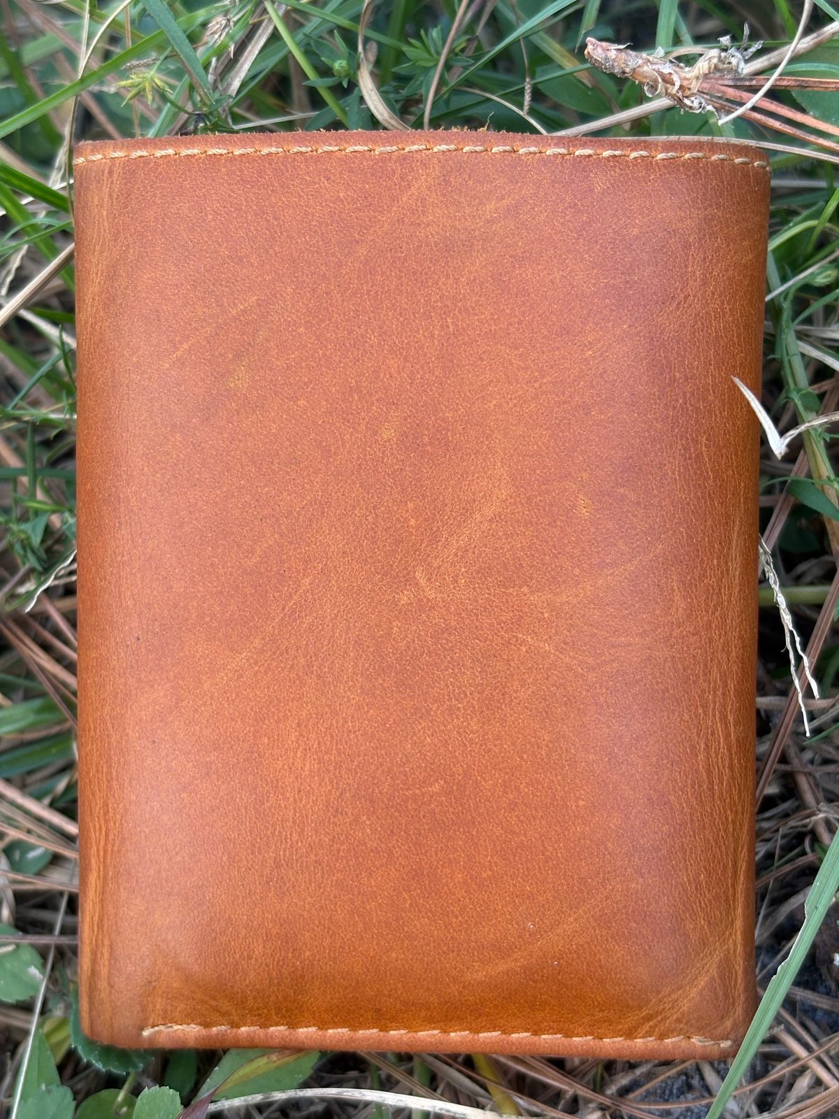 Photo by MuttBarker on November 5, 2025 of the Rodos Leather Crafts Camel Full Grain Leather Trifold Wallet in Tochigi Oil Vachetta #1 Light Brown.
