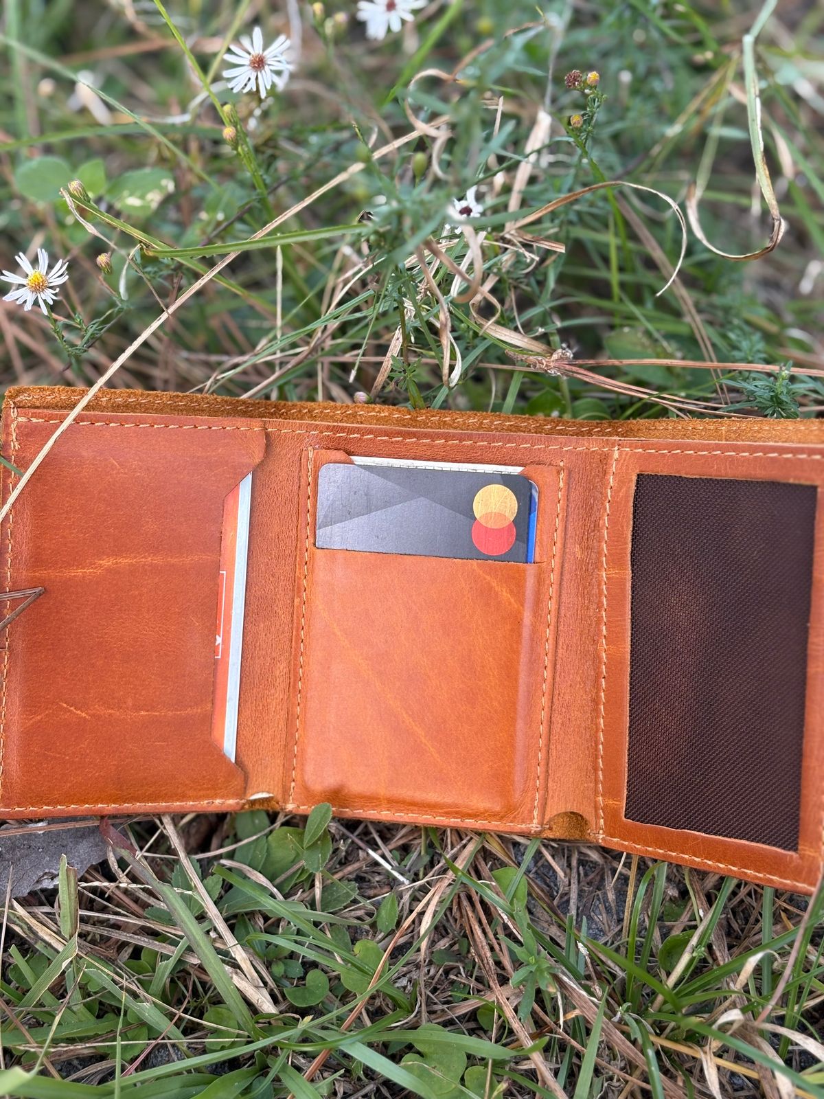 Photo by MuttBarker on November 5, 2025 of the Rodos Leather Crafts Camel Full Grain Leather Trifold Wallet in Tochigi Oil Vachetta #1 Light Brown.