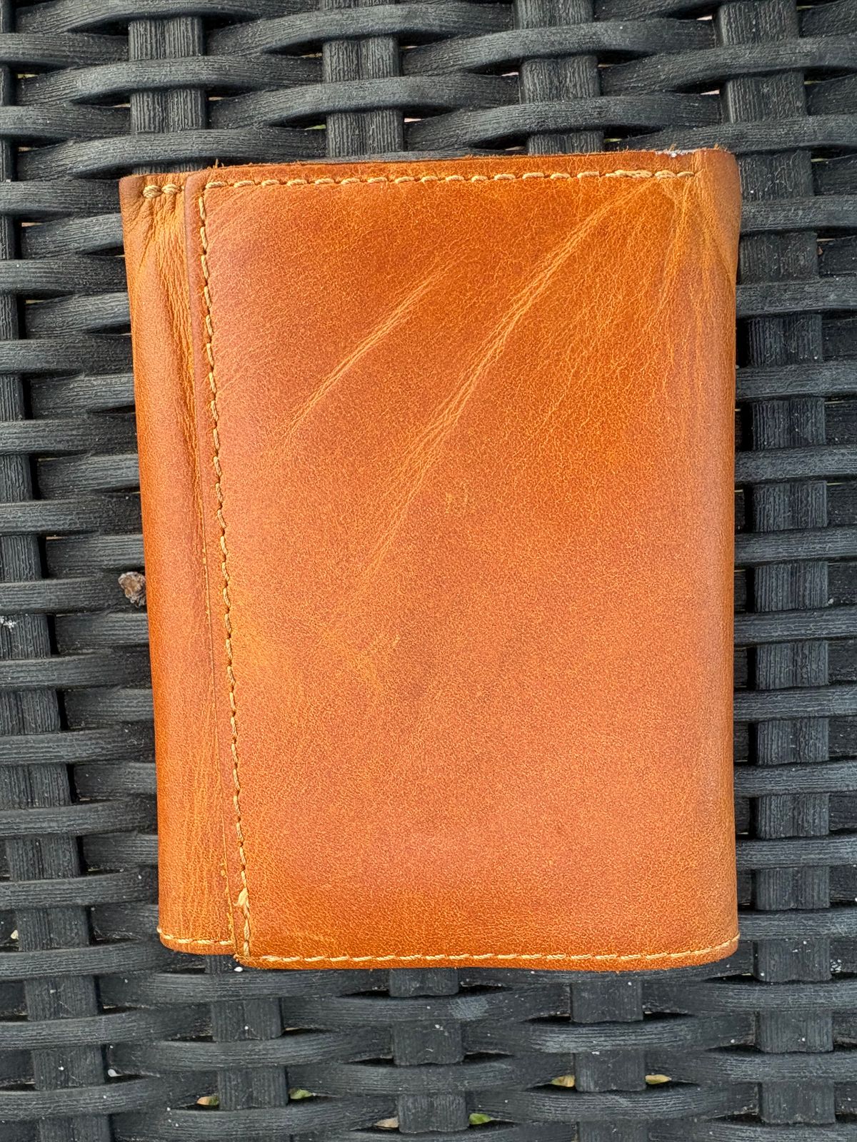 Photo by MuttBarker on November 5, 2025 of the Rodos Leather Crafts Camel Full Grain Leather Trifold Wallet in Tochigi Oil Vachetta #1 Light Brown.
