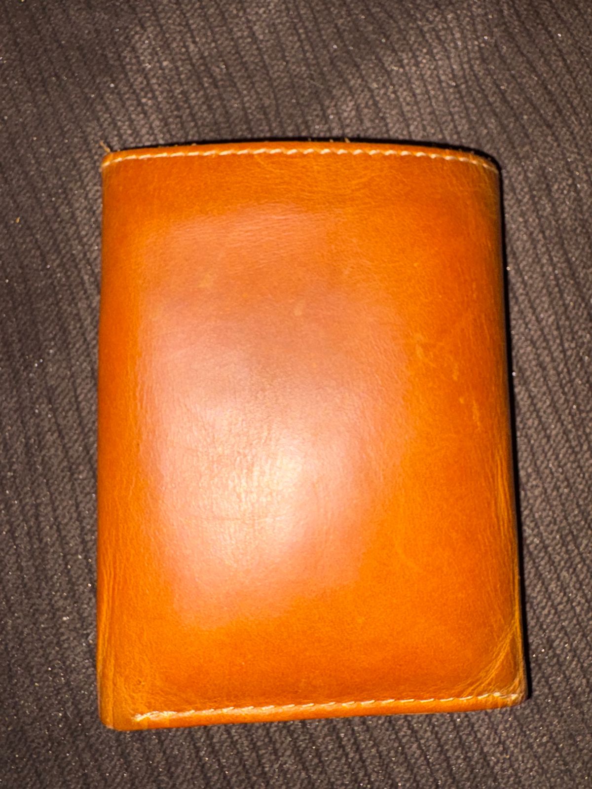 Photo by MuttBarker on December 5, 2025 of the Rodos Leather Crafts Camel Full Grain Leather Trifold Wallet in Tochigi Oil Vachetta #1 Light Brown.