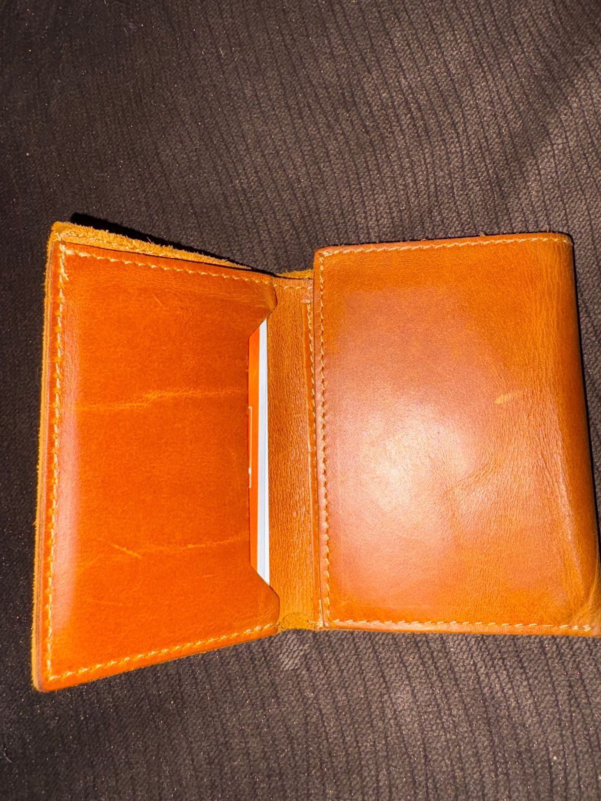 Photo by MuttBarker on December 5, 2025 of the Rodos Leather Crafts Camel Full Grain Leather Trifold Wallet in Tochigi Oil Vachetta #1 Light Brown.