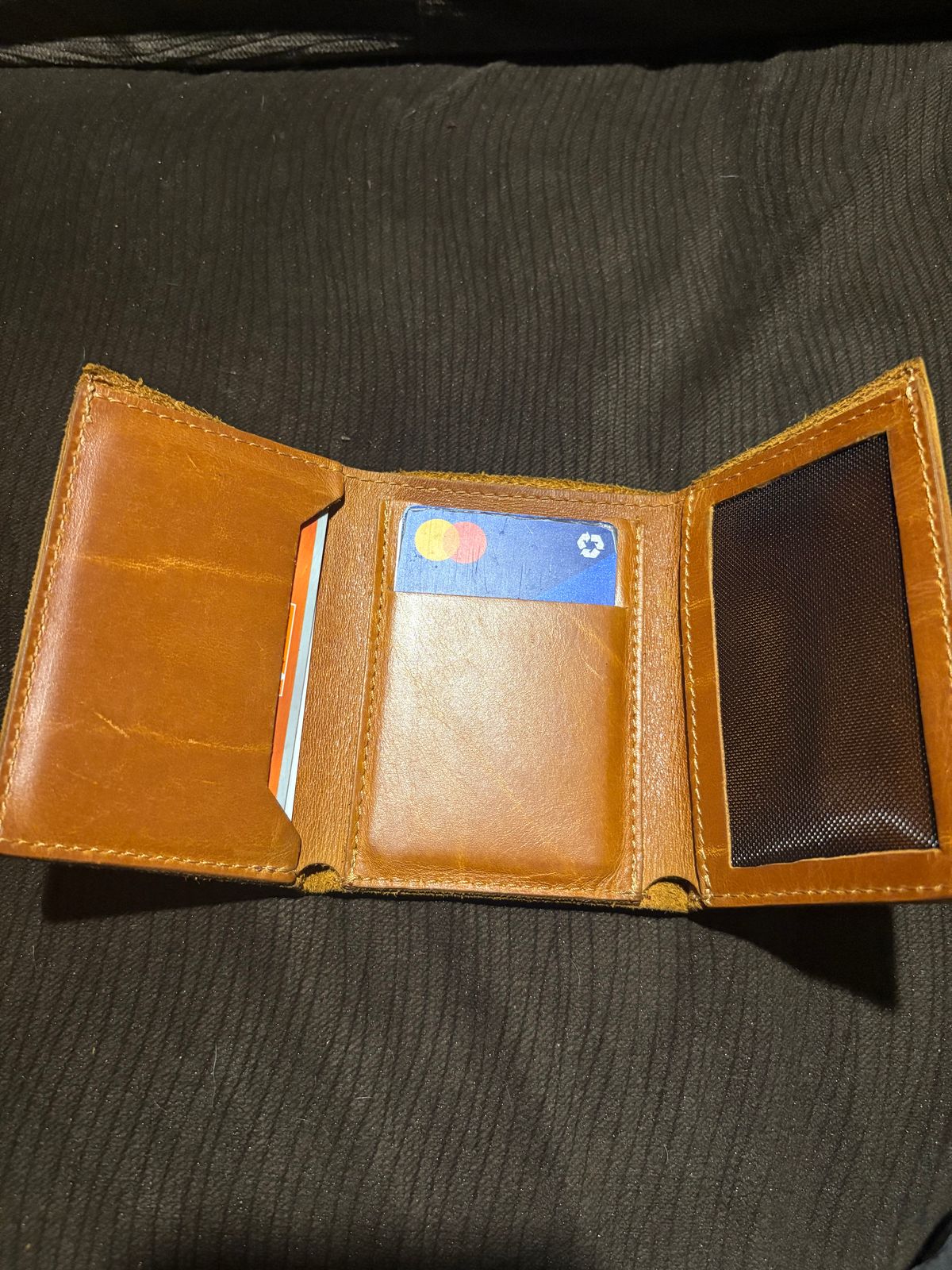 Photo by MuttBarker on December 5, 2025 of the Rodos Leather Crafts Camel Full Grain Leather Trifold Wallet in Tochigi Oil Vachetta #1 Light Brown.