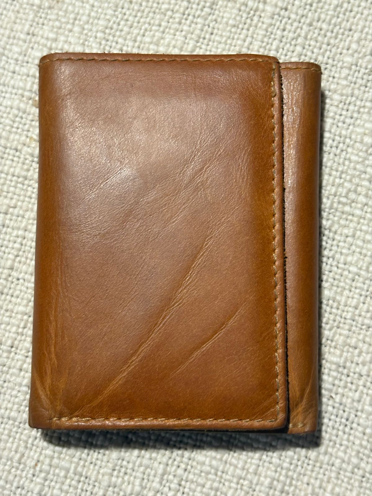 Photo by MuttBarker on January 6, 2026 of the Rodos Leather Crafts Camel Full Grain Leather Trifold Wallet in Tochigi Oil Vachetta #1 Light Brown.