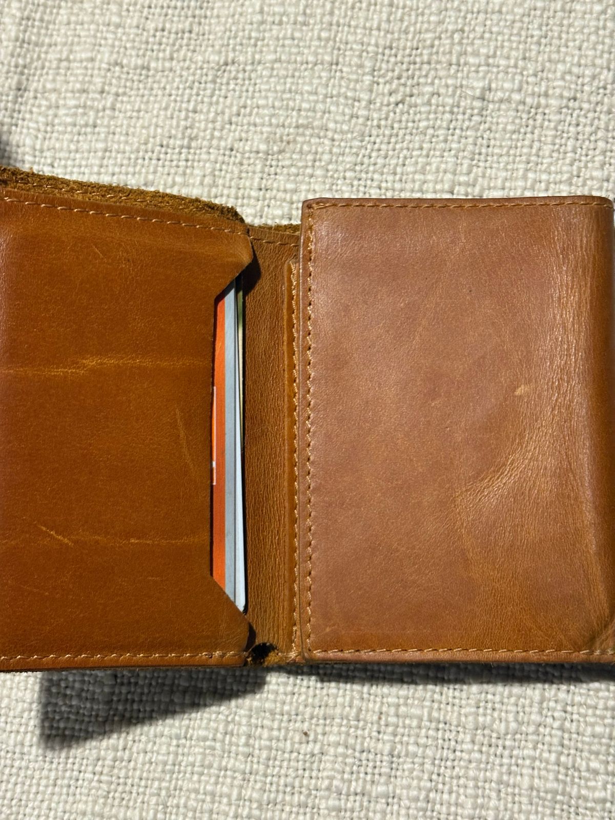 Photo by MuttBarker on January 6, 2026 of the Rodos Leather Crafts Camel Full Grain Leather Trifold Wallet in Tochigi Oil Vachetta #1 Light Brown.