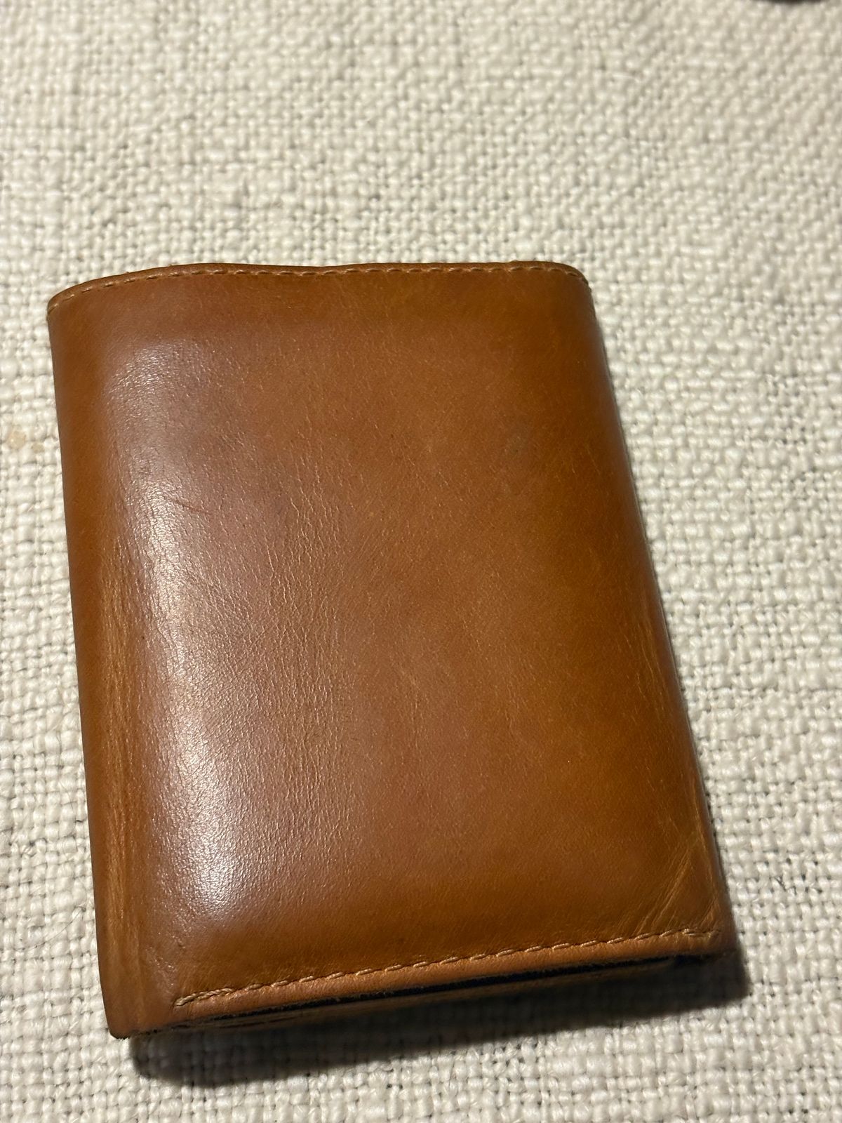 Photo by MuttBarker on January 6, 2026 of the Rodos Leather Crafts Camel Full Grain Leather Trifold Wallet in Tochigi Oil Vachetta #1 Light Brown.