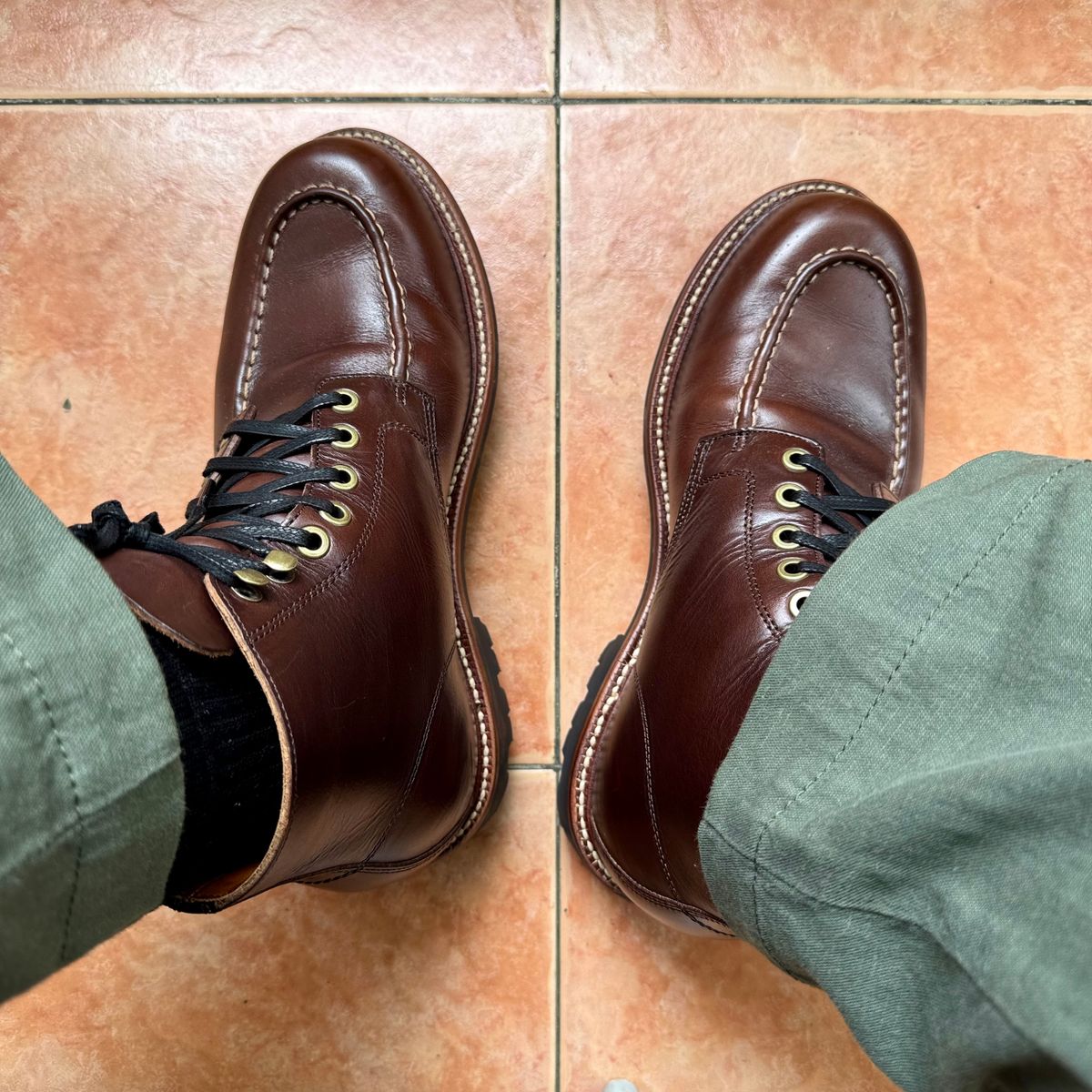 Photo by stinkypatina on October 10, 2025 of the Grant Stone Brass Boot in Horween Crimson Chromexcel.