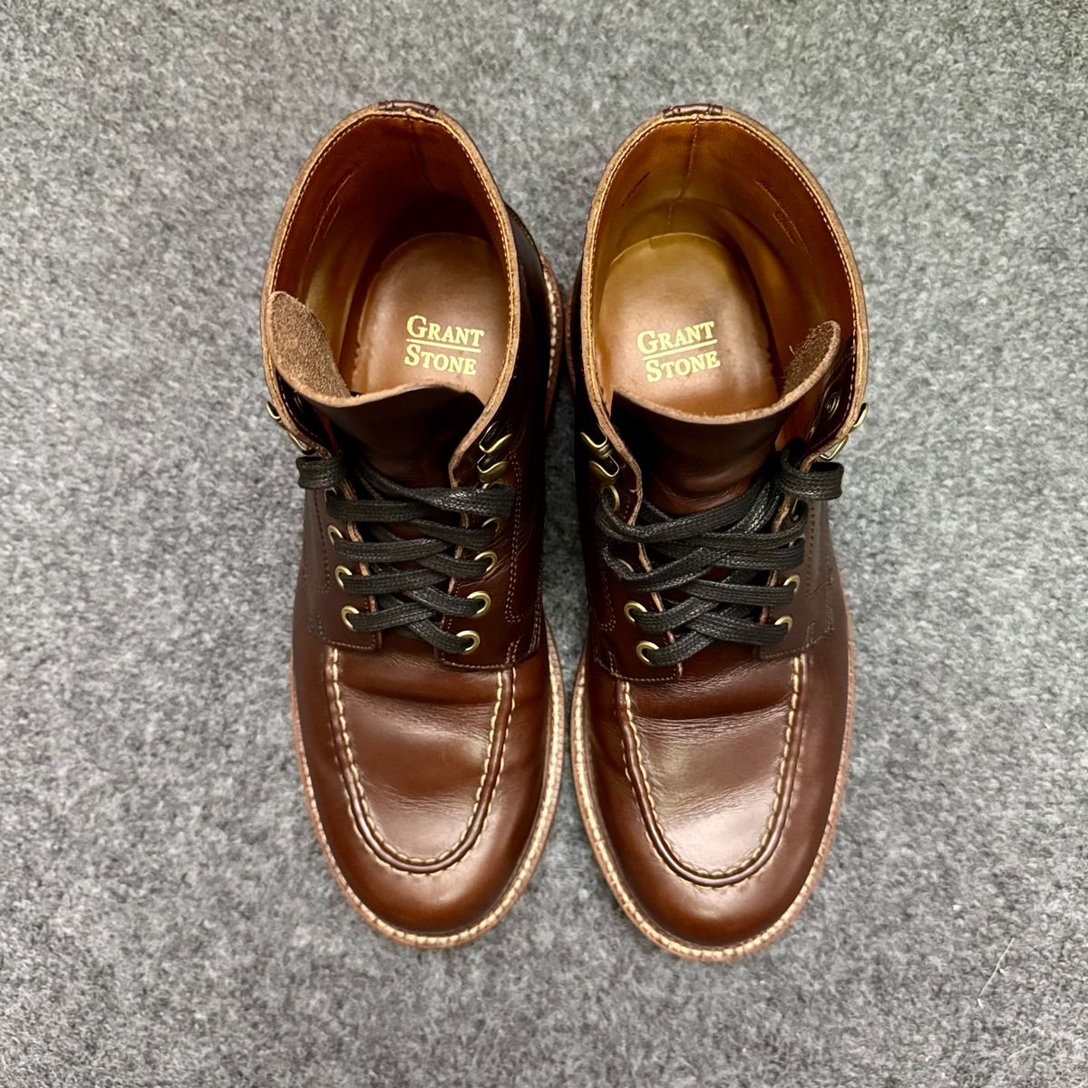 Photo by stinkypatina on October 12, 2025 of the Grant Stone Brass Boot in Horween Crimson Chromexcel.