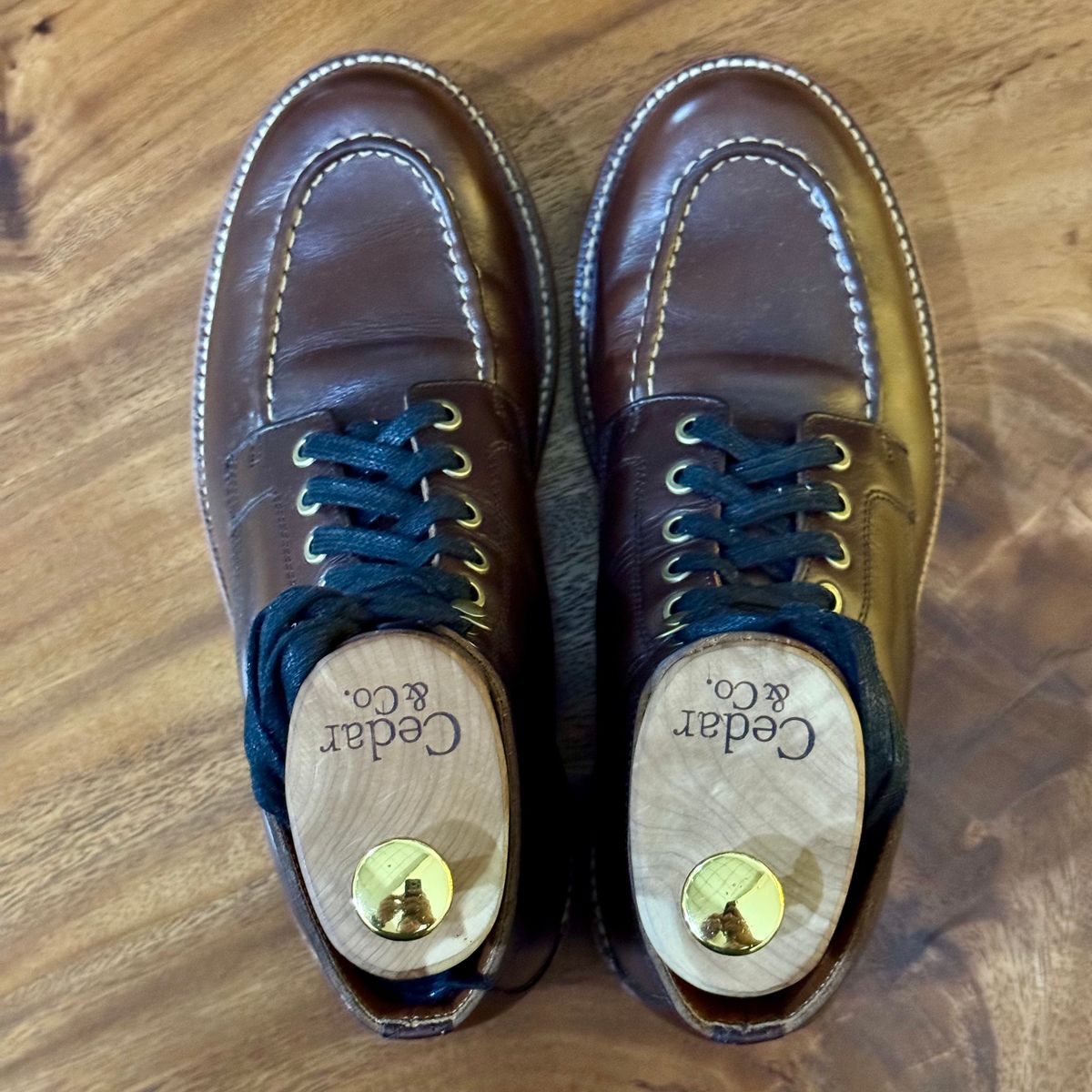 Photo by stinkypatina on December 2, 2025 of the Grant Stone Brass Boot in Horween Crimson Chromexcel.