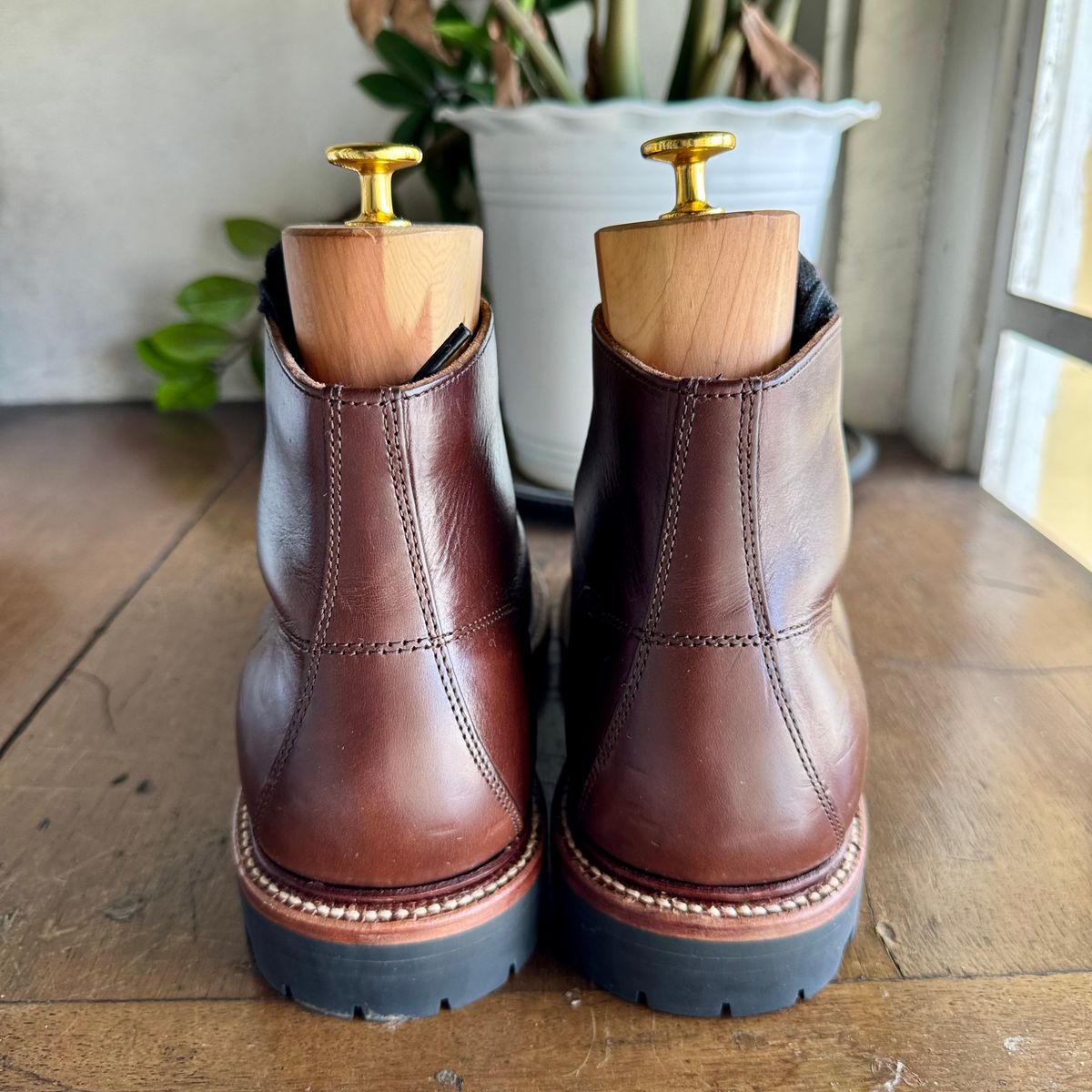 Photo by stinkypatina on January 4, 2026 of the Grant Stone Brass Boot in Horween Crimson Chromexcel.
