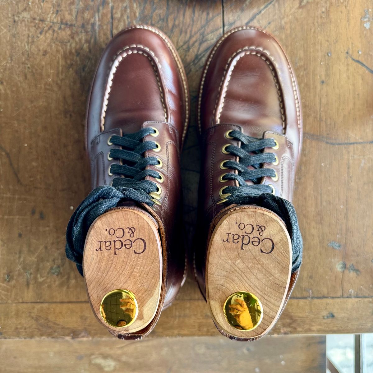 Photo by stinkypatina on January 4, 2026 of the Grant Stone Brass Boot in Horween Crimson Chromexcel.