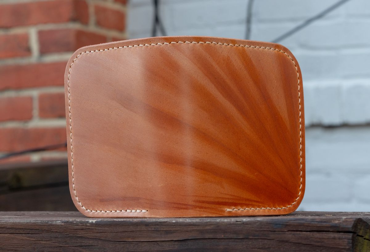 Photo by TheJewishJesus on October 1, 2025 of the Wild Frontier Goods Frontier Bifold Wallet in Kakishibu Hand Painted Shell Cordovan & Natural Buffed Cowhide.