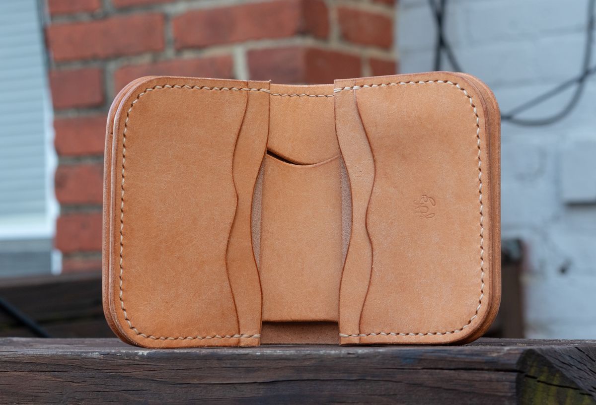 Photo by TheJewishJesus on October 1, 2025 of the Wild Frontier Goods Frontier Bifold Wallet in Kakishibu Hand Painted Shell Cordovan & Natural Buffed Cowhide.
