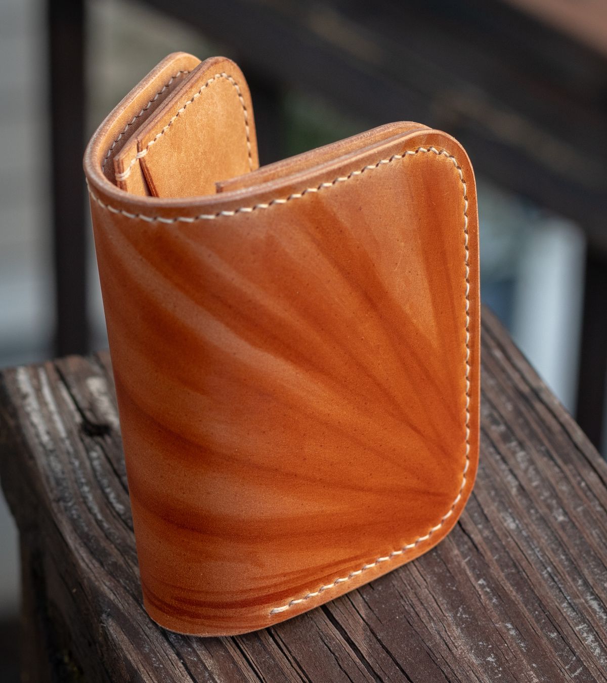 Photo by TheJewishJesus on August 30, 2025 of the Wild Frontier Goods Frontier Bifold Wallet in Kakishibu Hand Painted Shell Cordovan & Natural Buffed Cowhide.
