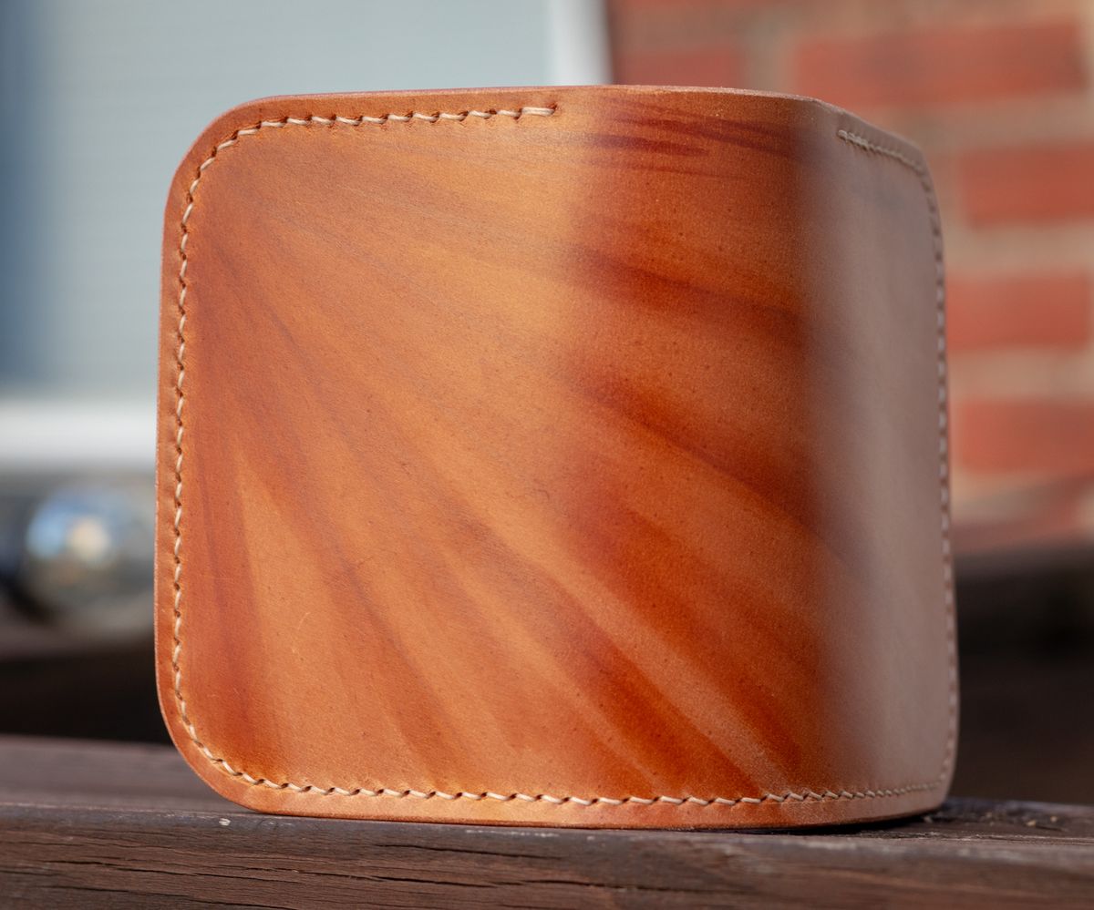 Photo by TheJewishJesus on August 30, 2025 of the Wild Frontier Goods Frontier Bifold Wallet in Kakishibu Hand Painted Shell Cordovan & Natural Buffed Cowhide.