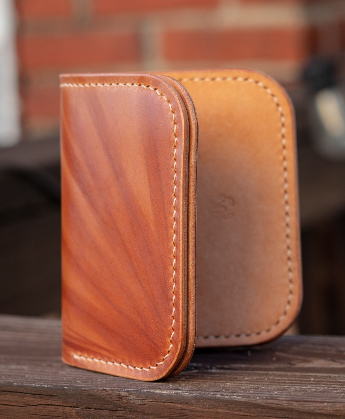 Photo by TheJewishJesus on August 30, 2025 of the Wild Frontier Goods Frontier Bifold Wallet in Kakishibu Hand Painted Shell Cordovan & Natural Buffed Cowhide.