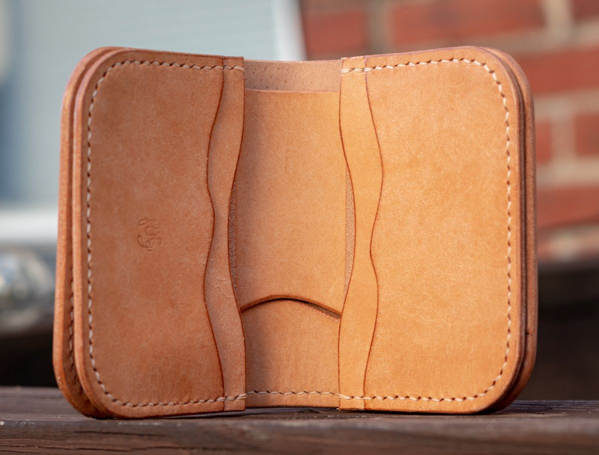 Photo by TheJewishJesus on August 30, 2025 of the Wild Frontier Goods Frontier Bifold Wallet in Kakishibu Hand Painted Shell Cordovan & Natural Buffed Cowhide.