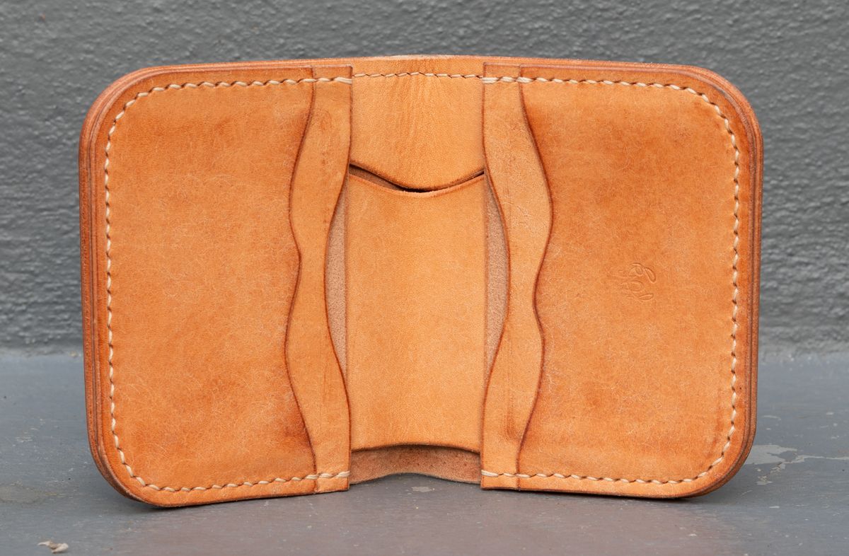 Photo by JewishJesus on November 2, 2025 of the Wild Frontier Goods Frontier Bifold Wallet in Kakishibu Hand Painted Shell Cordovan & Natural Buffed Cowhide.