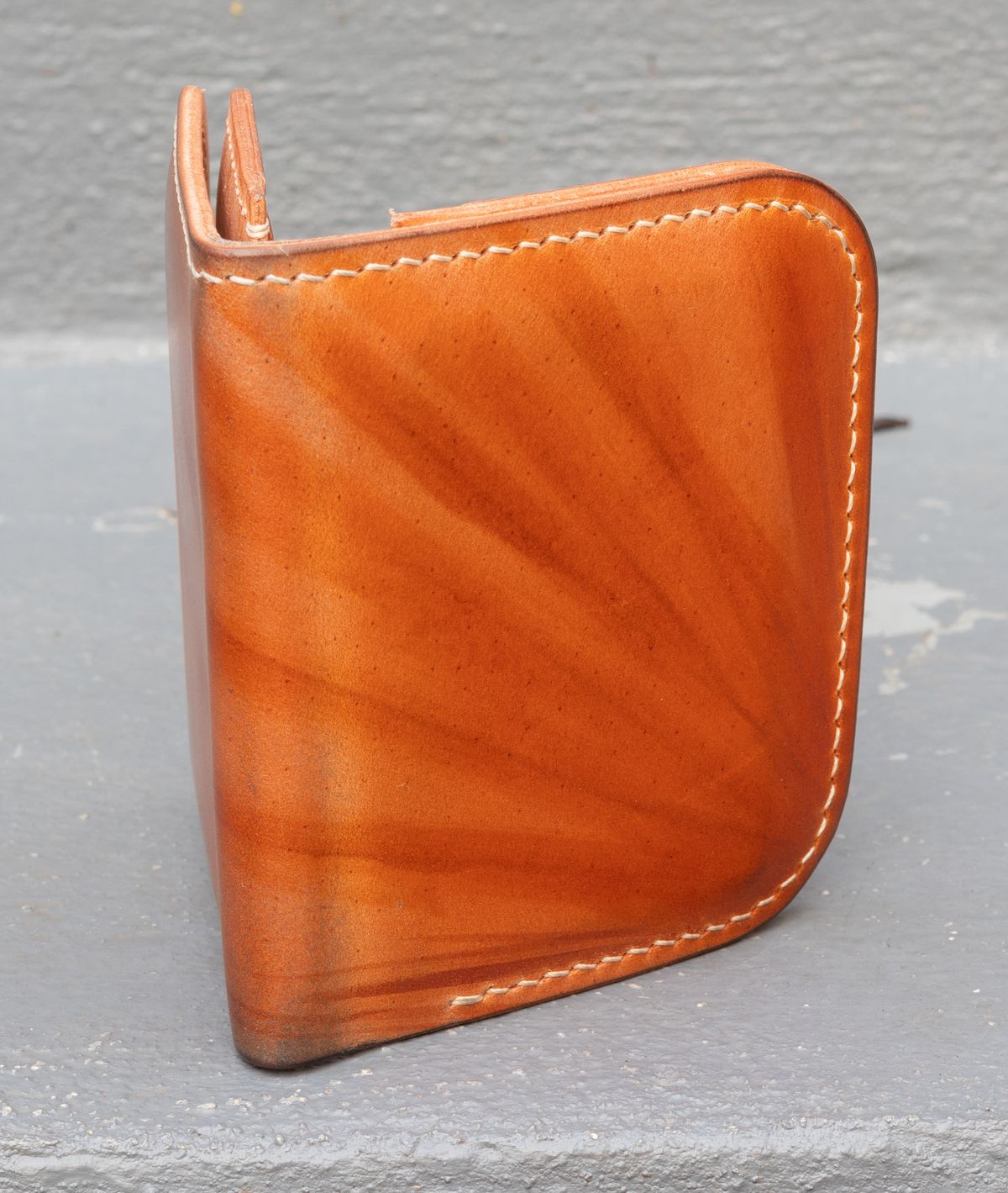 Photo by JewishJesus on November 2, 2025 of the Wild Frontier Goods Frontier Bifold Wallet in Kakishibu Hand Painted Shell Cordovan & Natural Buffed Cowhide.