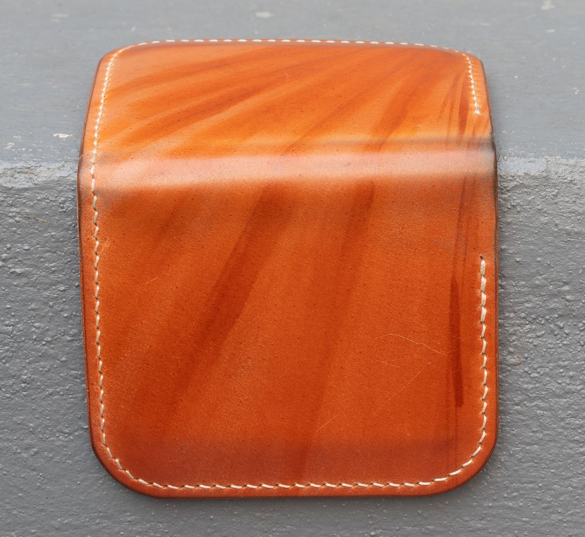 Photo by JewishJesus on November 2, 2025 of the Wild Frontier Goods Frontier Bifold Wallet in Kakishibu Hand Painted Shell Cordovan & Natural Buffed Cowhide.