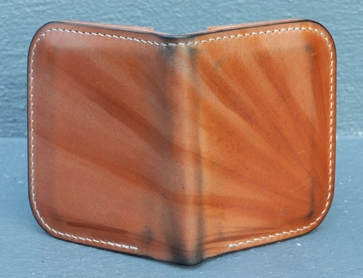 Photo by JewishJesus on December 3, 2025 of the Wild Frontier Goods Frontier Bifold Wallet in Kakishibu Hand Painted Shell Cordovan & Natural Buffed Cowhide.