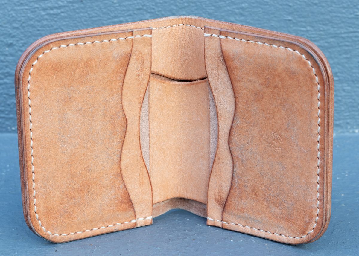 Photo by JewishJesus on December 3, 2025 of the Wild Frontier Goods Frontier Bifold Wallet in Kakishibu Hand Painted Shell Cordovan & Natural Buffed Cowhide.