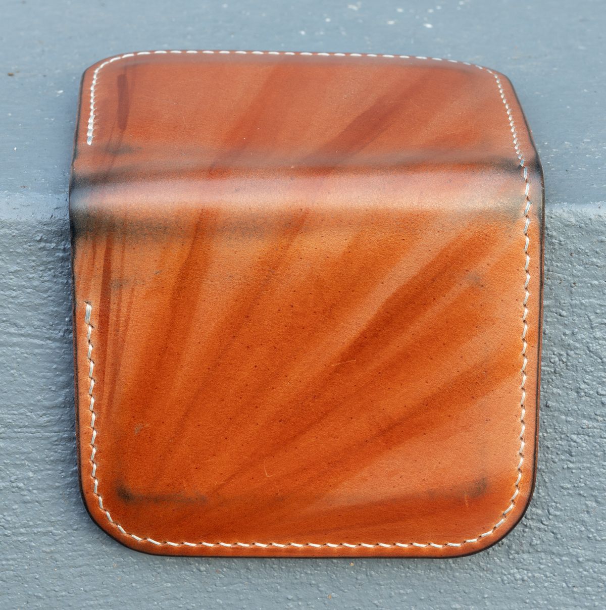 Photo by JewishJesus on December 3, 2025 of the Wild Frontier Goods Frontier Bifold Wallet in Kakishibu Hand Painted Shell Cordovan & Natural Buffed Cowhide.