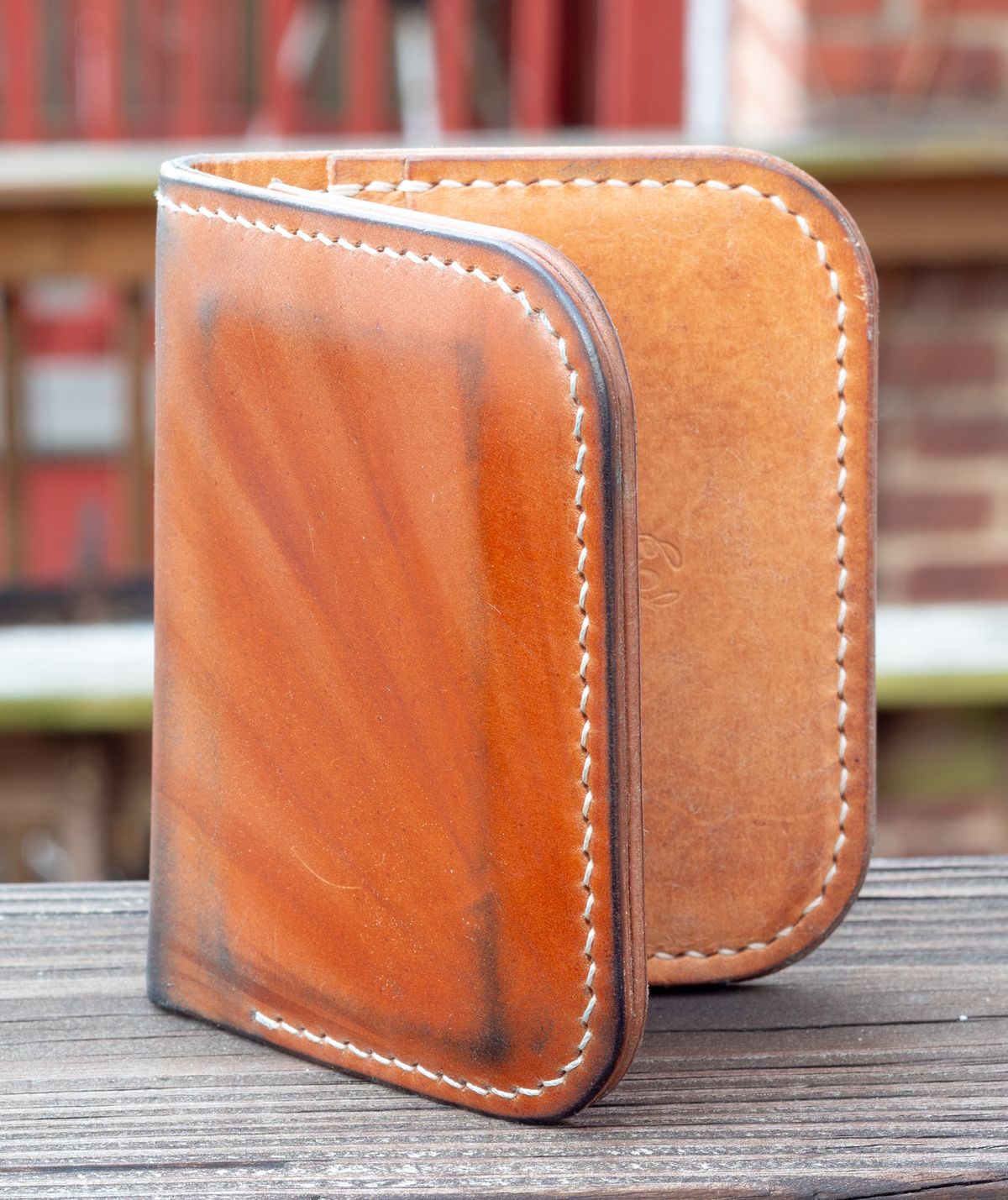 Photo by JewishJesus on April 1, 2026 of the Wild Frontier Goods Frontier Bifold Wallet in Kakishibu Hand Painted Shell Cordovan & Natural Buffed Cowhide.