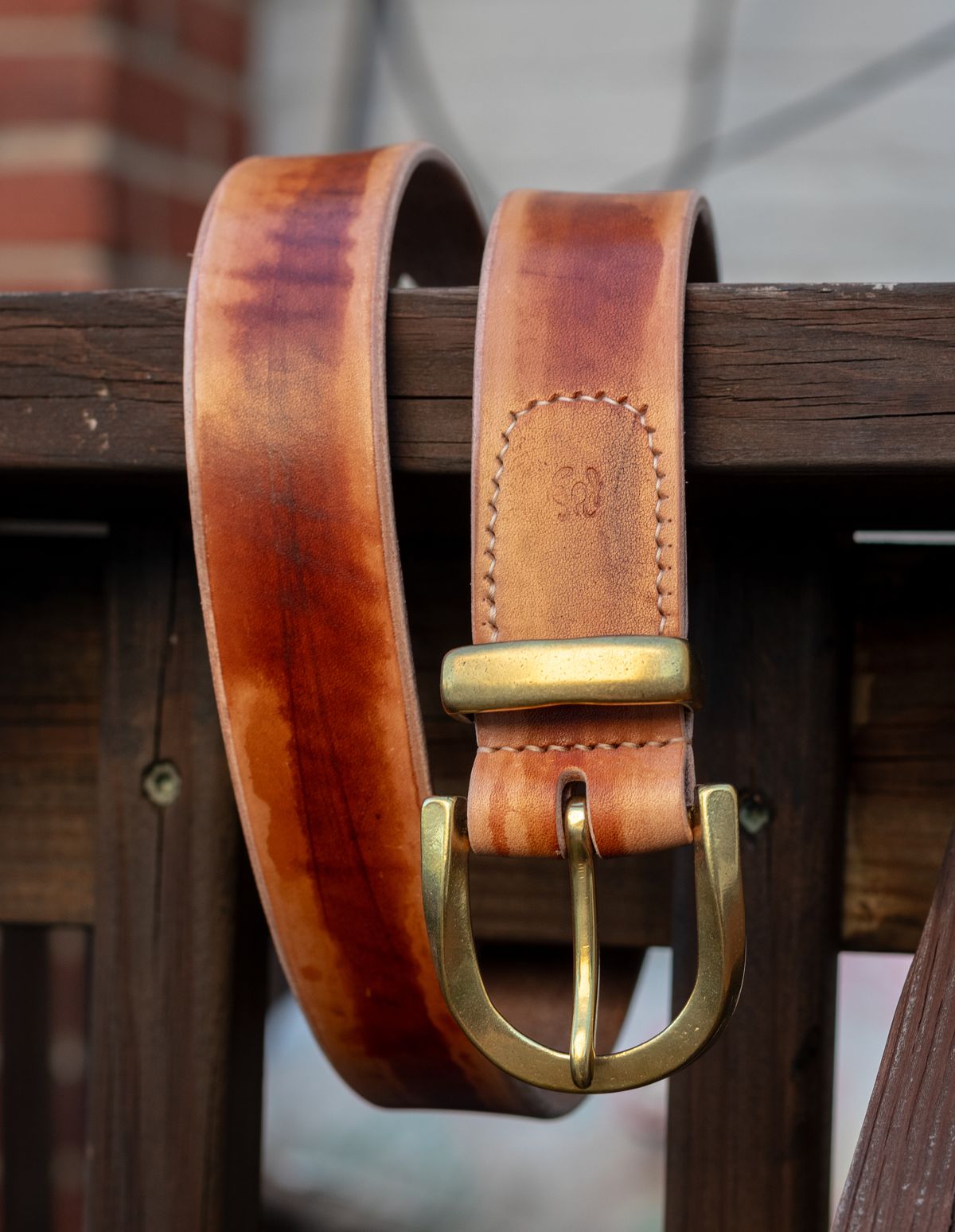 Photo by TheJewishJesus on August 30, 2025 of the Wild Frontier Goods Two-Piece Twisted Buckle Belt & Key Ring in Hand-Painted Kakishibu Saddle Cowhide & Shinki Orange Shell Cordovan.