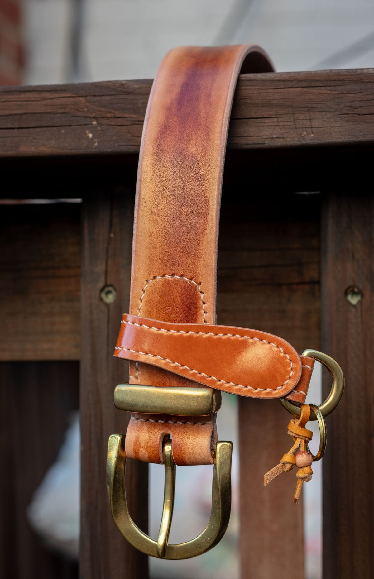 Photo by TheJewishJesus on August 30, 2025 of the Wild Frontier Goods Two-Piece Twisted Buckle Belt & Key Ring in Hand-Painted Kakishibu Saddle Cowhide & Shinki Orange Shell Cordovan.