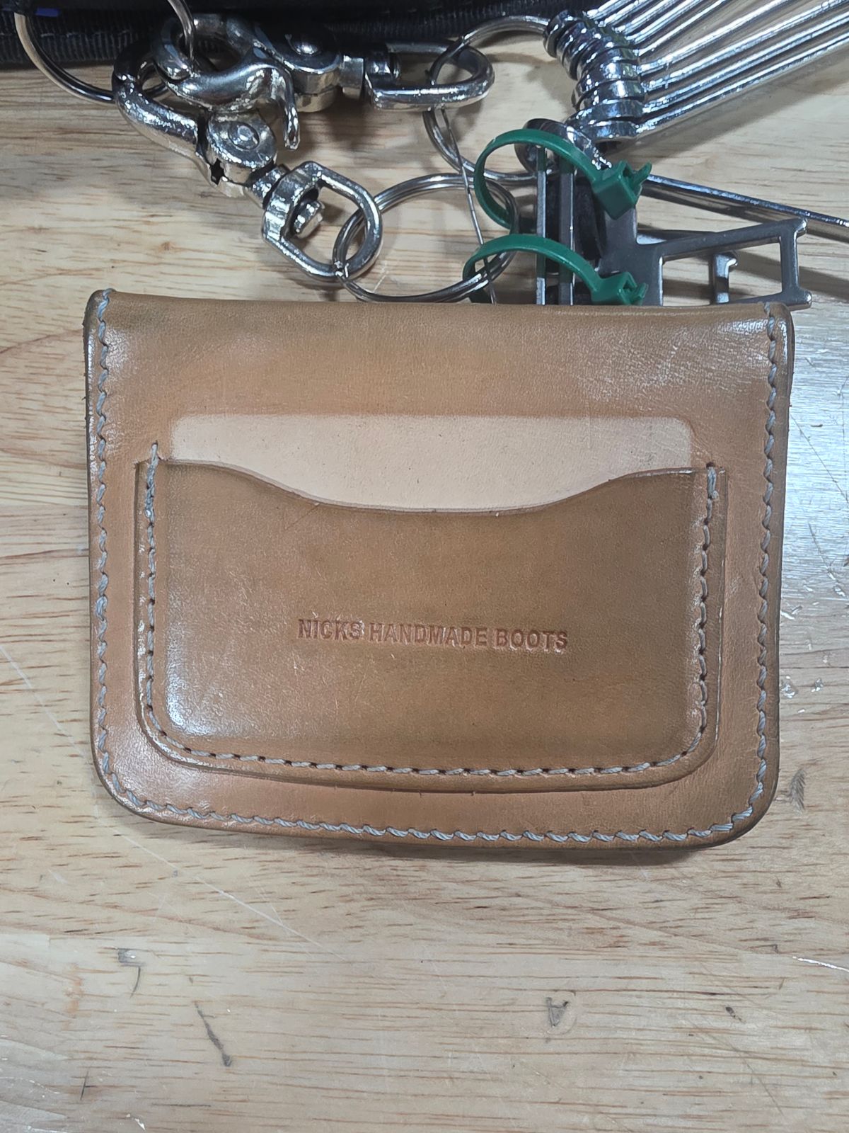 Photo by zestyclosemedicine on December 2, 2025 of the Nicks Mini Trucker Wallet in Wickett & Craig Natural Skirting.