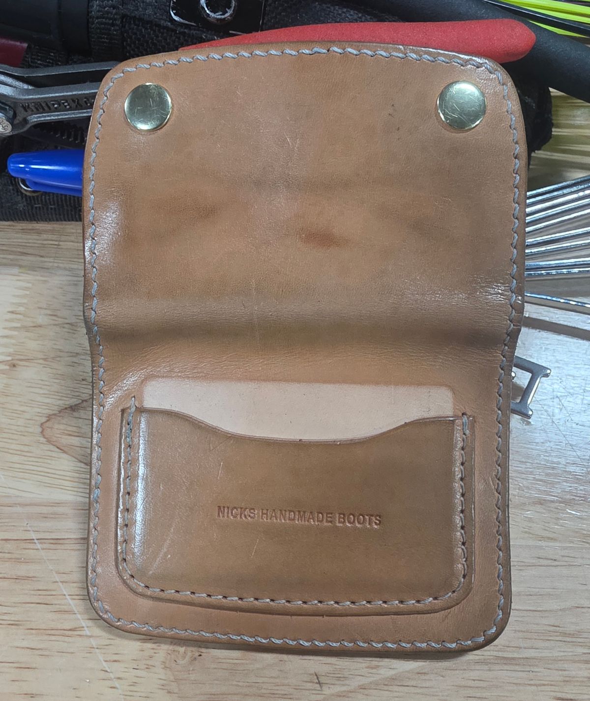 Photo by zestyclosemedicine on December 2, 2025 of the Nicks Mini Trucker Wallet in Wickett & Craig Natural Skirting.