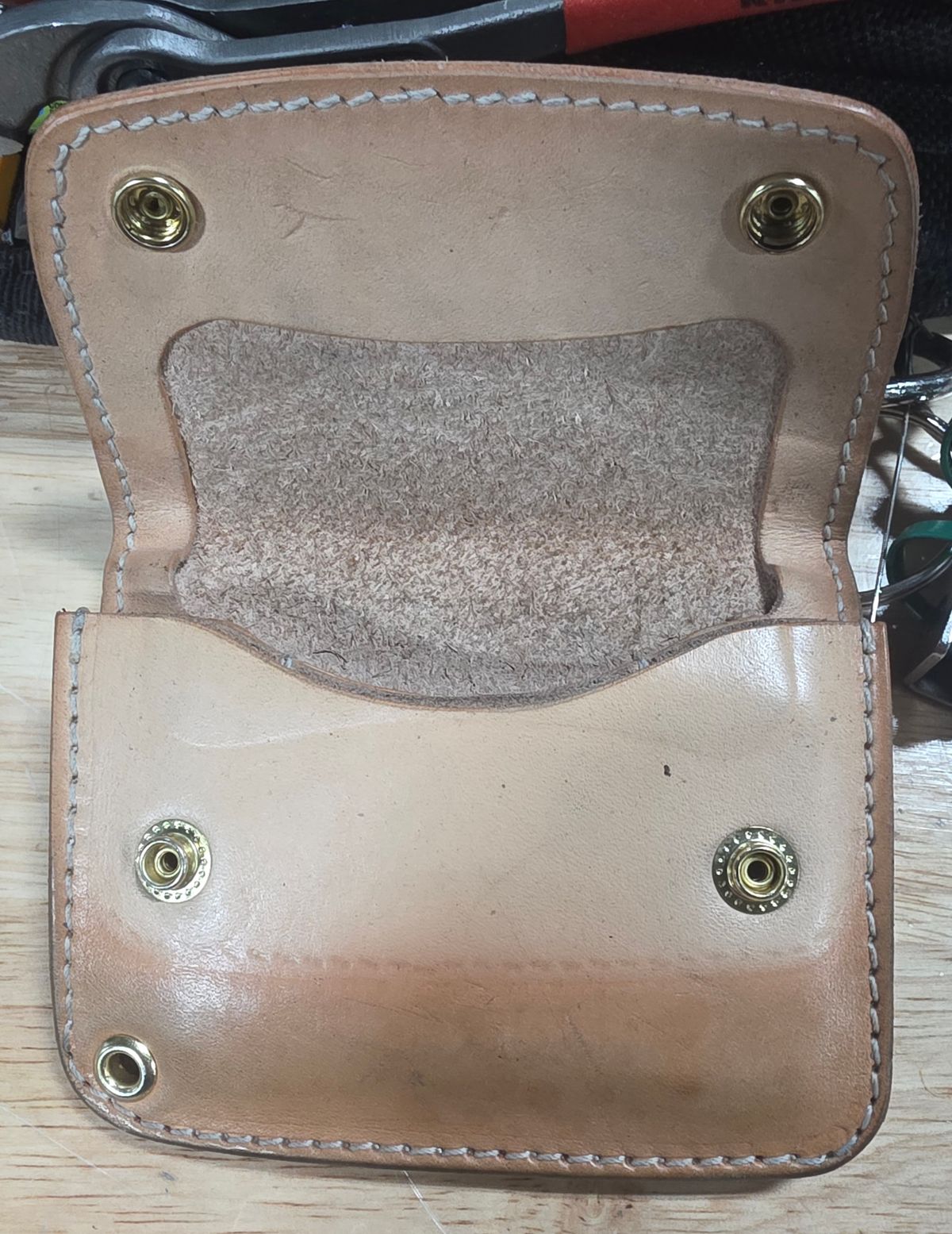 Photo by zestyclosemedicine on December 2, 2025 of the Nicks Mini Trucker Wallet in Wickett & Craig Natural Skirting.