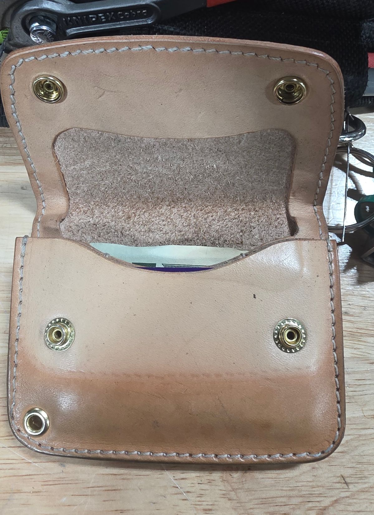 Photo by zestyclosemedicine on December 2, 2025 of the Nicks Mini Trucker Wallet in Wickett & Craig Natural Skirting.