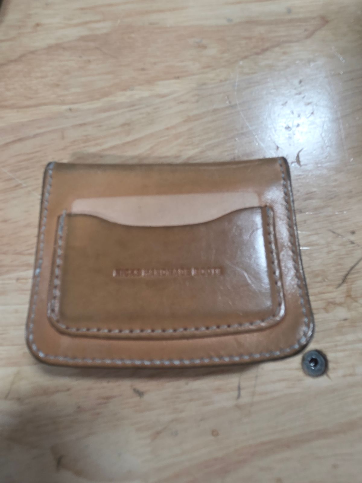 Photo by zestyclosemedicine on December 19, 2025 of the Nicks Mini Trucker Wallet in Wickett & Craig Natural Skirting.