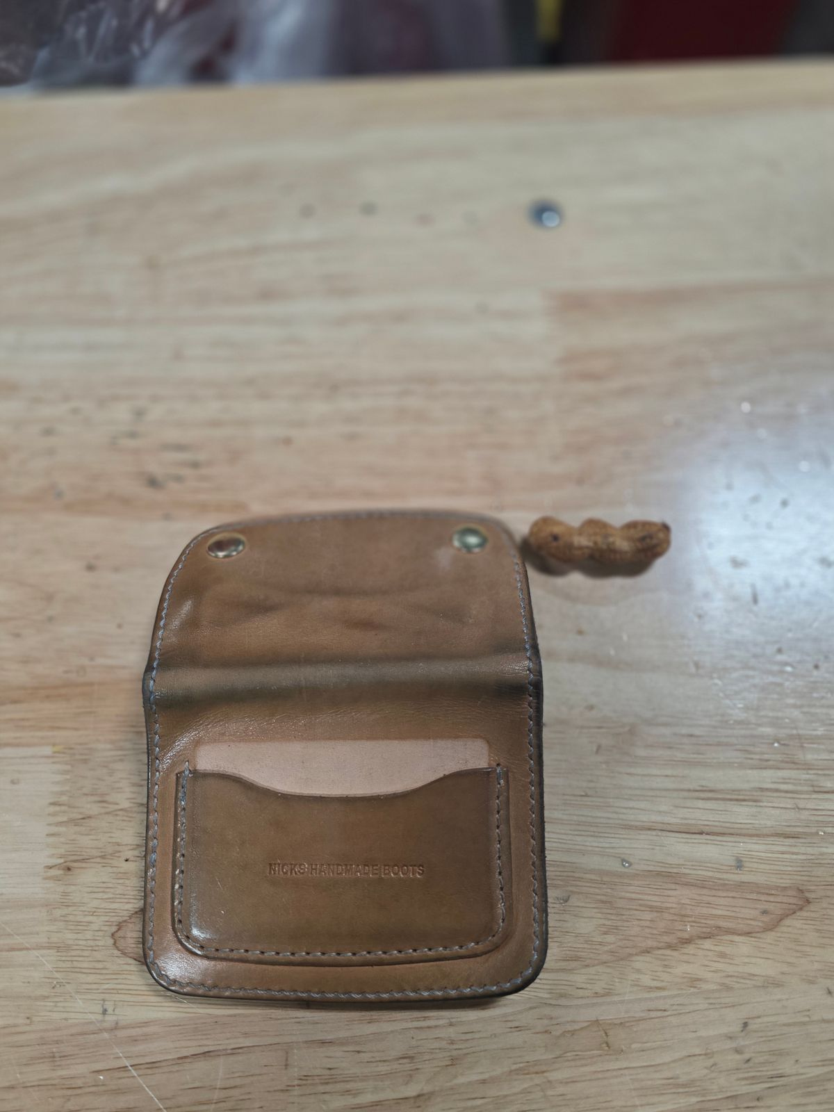 Photo by zestyclosemedicine on February 2, 2026 of the Nicks Mini Trucker Wallet in Wickett & Craig Natural Skirting.