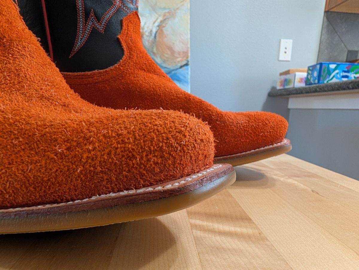 Photo by alkemest on July 3, 2025 of the Fenoglio Orange Roughout With Black Smooth Italian Uppers, Outpost Western Exclusive in Fenoglio Orange Roughout.