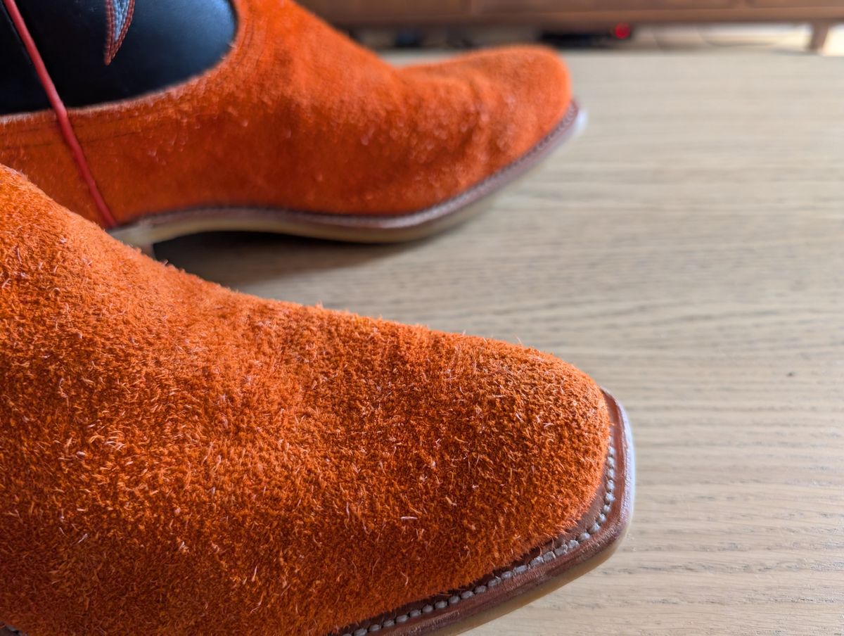Photo by alkemest on July 9, 2025 of the Fenoglio Orange Roughout With Black Smooth Italian Uppers, Outpost Western Exclusive in Fenoglio Orange Roughout.