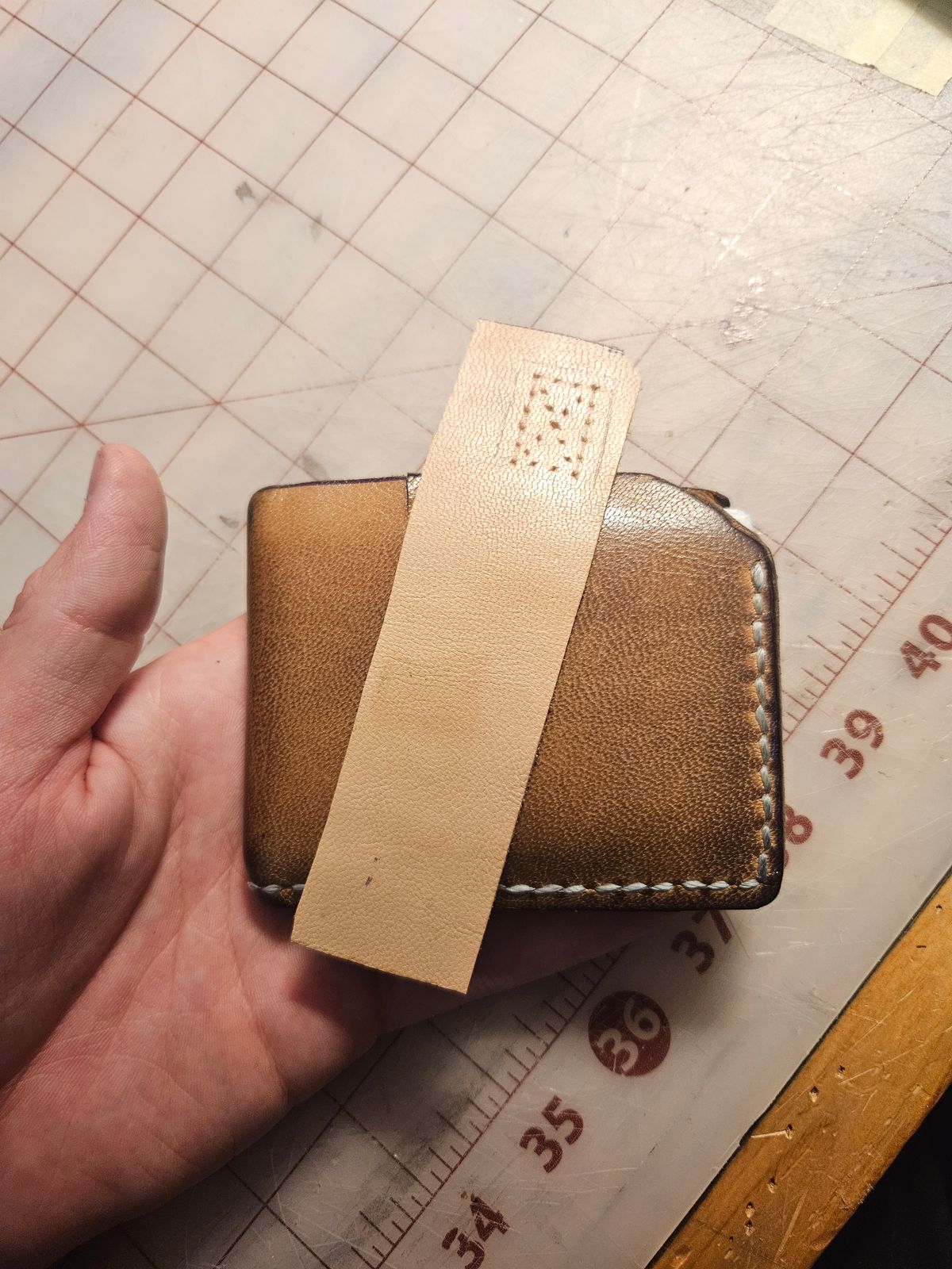 Photo by Jakesleather1505 on May 23, 2025 of the Self Made Bi Fold in 1mm Veg Tan Goat Hide.